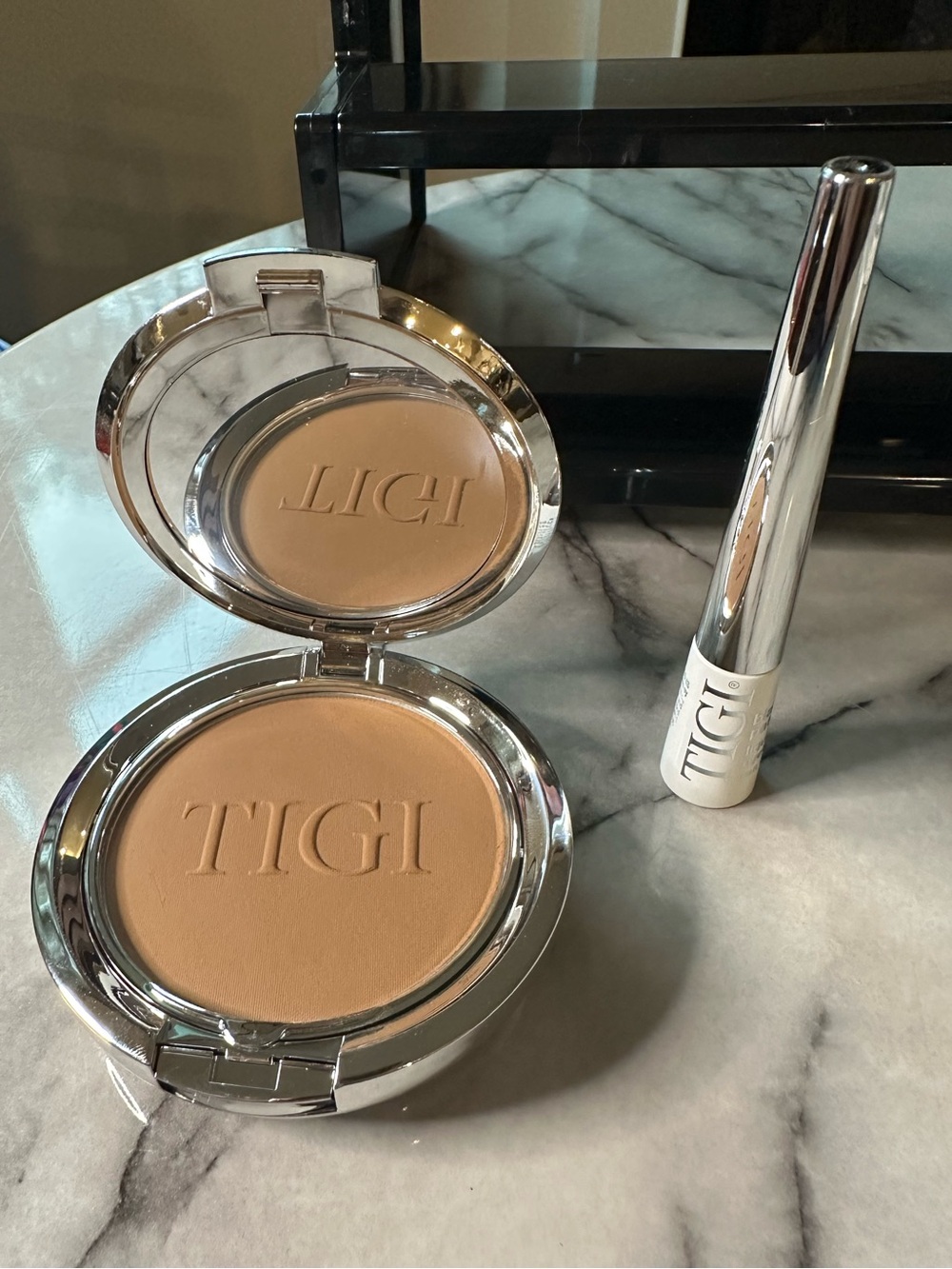 TIGI Compact Pressed Setting Powder color- Entice, black liquid eyeliner